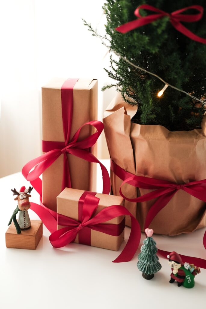 A christmas tree with presents wrapped in brown paper